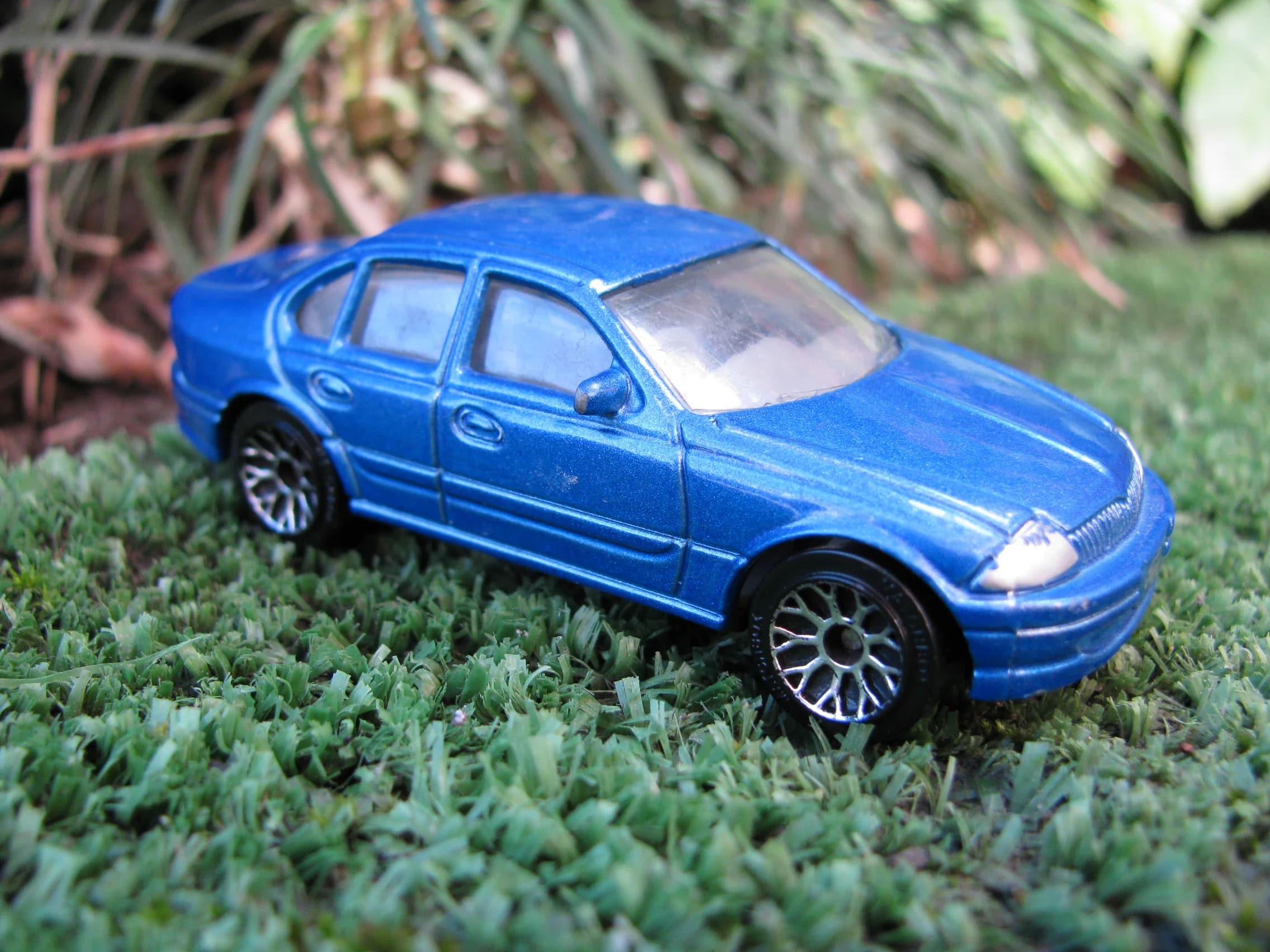 Blue Matchbox Ford AU Falcon toy car on grass